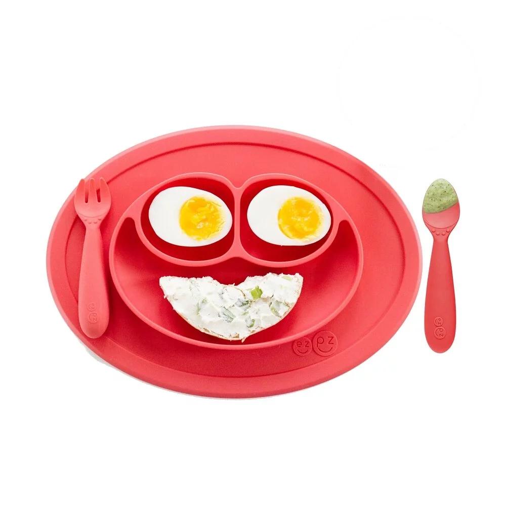 https://www.mightyrabbit.com/cdn/shop/products/ezpz-silicone-mini-mat-_-utensils-feeding-set-coral-_9_1200x.jpg?v=1624940911